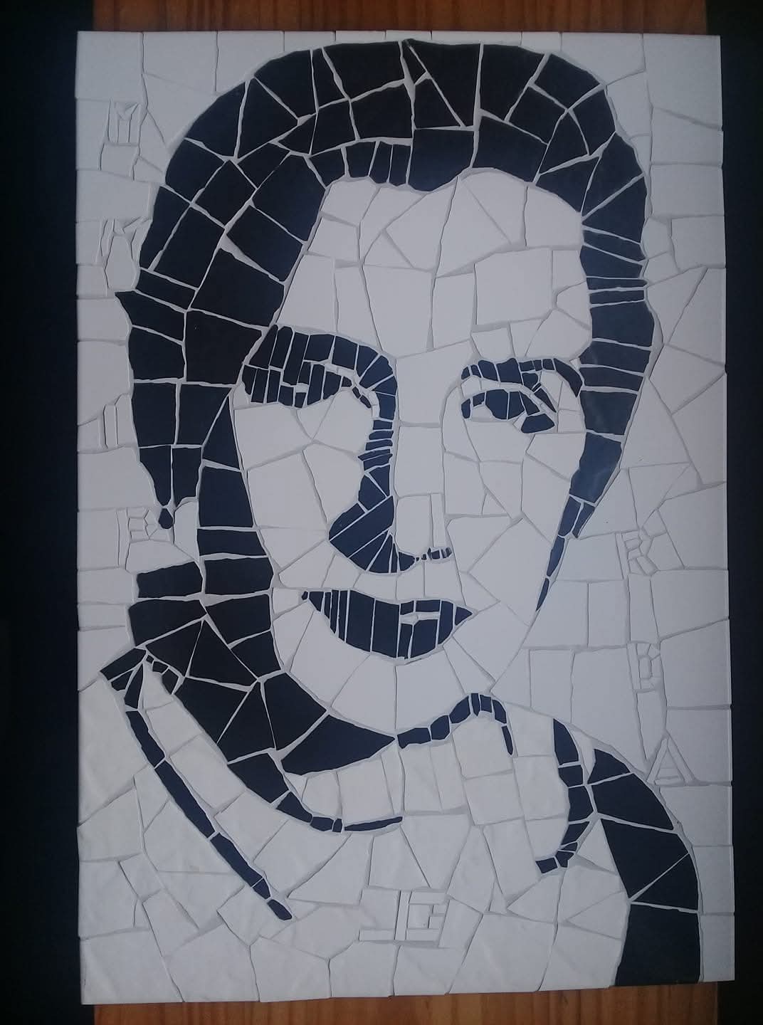 Monochrome mosaic portrait from the artist's approved archive.